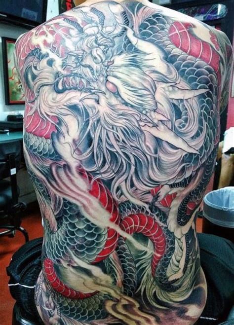 dragon back tattoo male|tribal dragon tattoos for men.